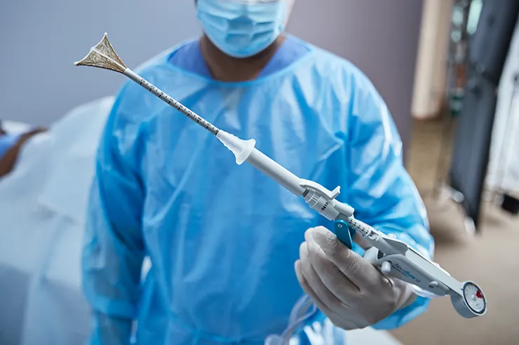 Clinician is holding a hysteroscopic device
